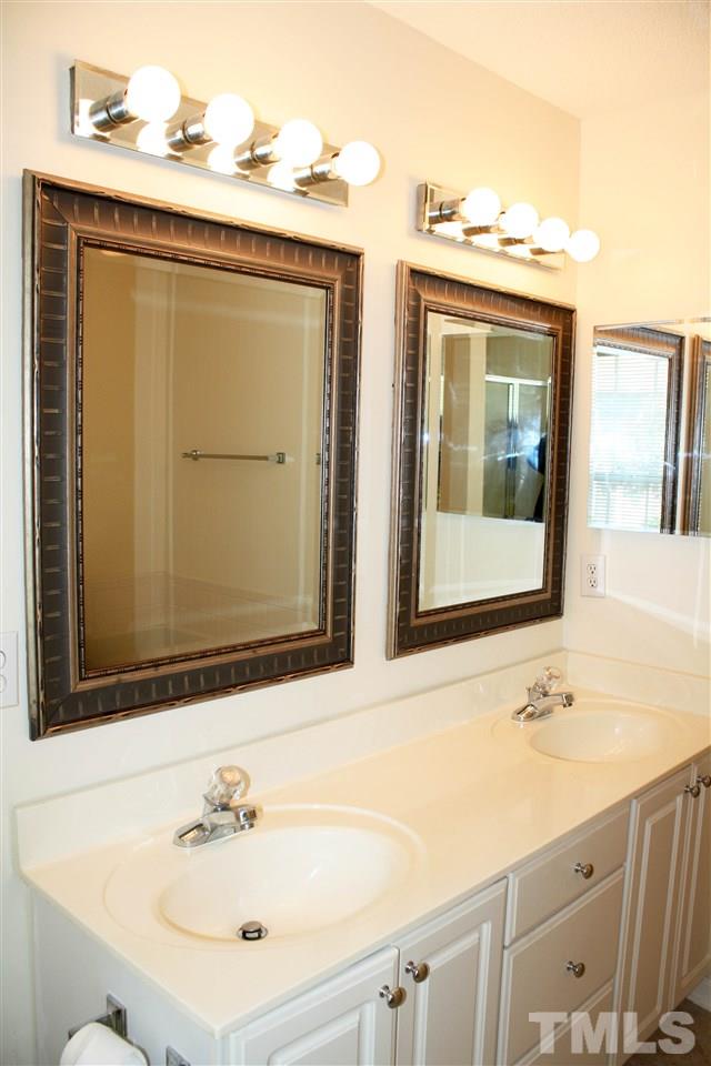 4435 Still Pines Drive Raleigh, NC 27613 - Photo 13 of 19 a bathroom with a sink and a mirror