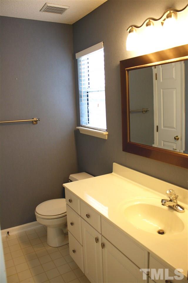 4435 Still Pines Drive Raleigh, NC 27613 - Photo 15 of 19 a bathroom with a sink and a toilet