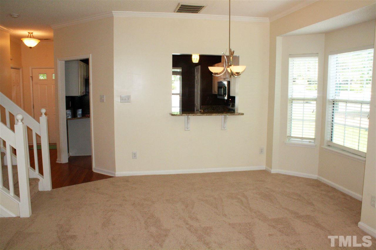 4435 Still Pines Drive Raleigh, NC 27613 - Photo 7 of 19 a view of empty room with windows and cabinet