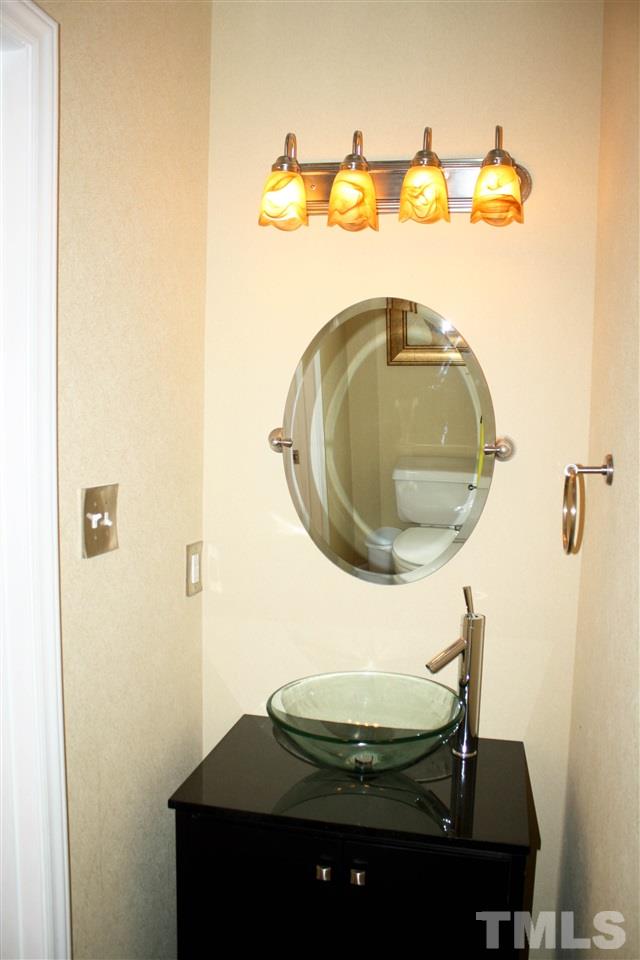 4435 Still Pines Drive Raleigh, NC 27613 - Photo 10 of 19 a bathroom with a sink and a mirror