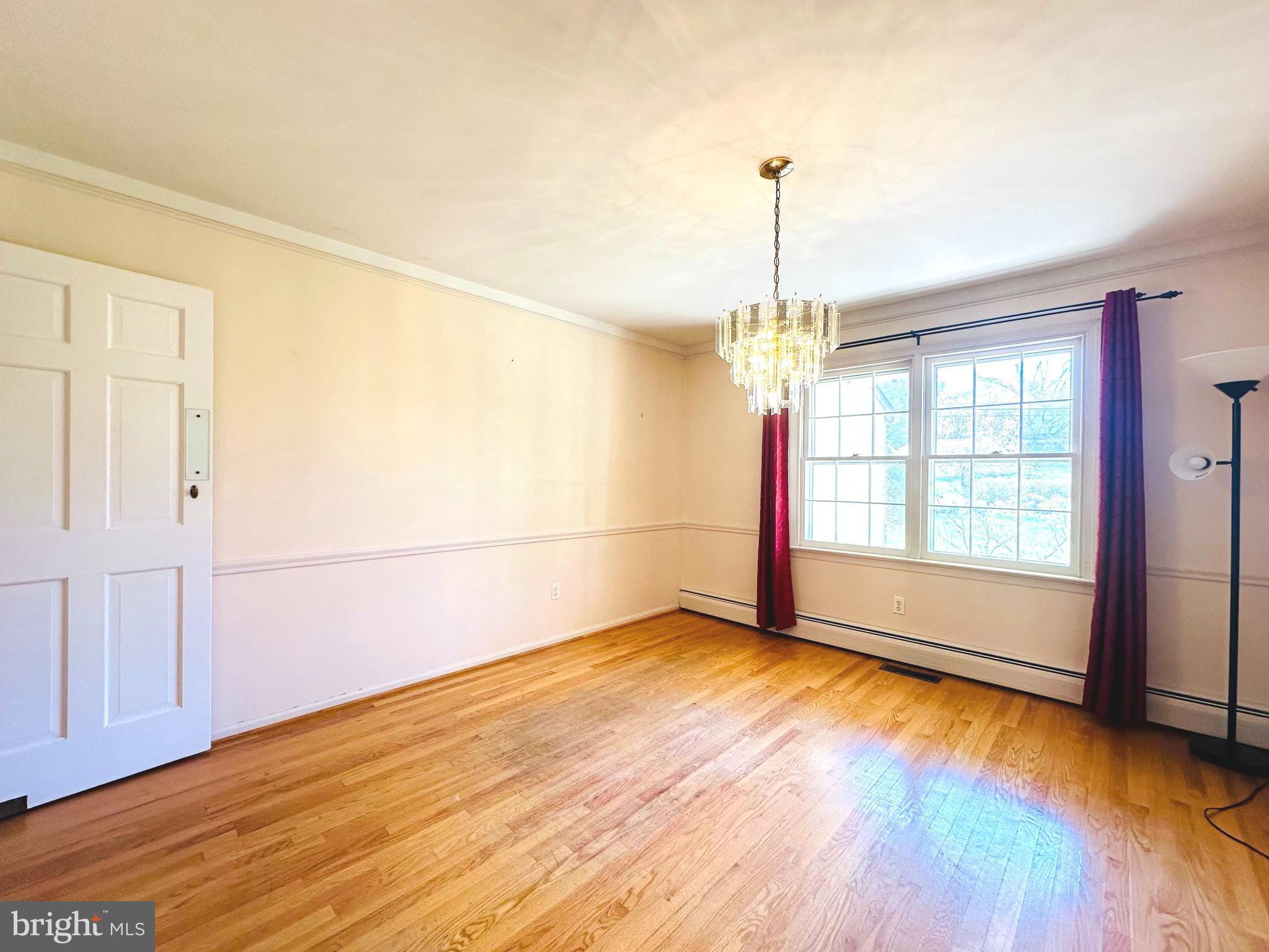 1626 Norristown Road Ambler, PA 19002 - Photo 21 of 57 wooden floor in an empty room with a window