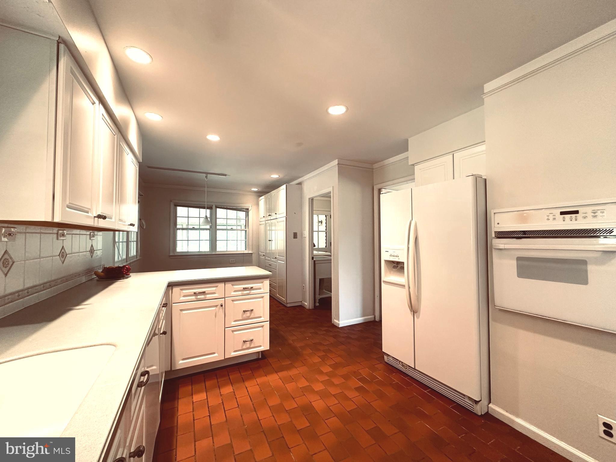 1626 Norristown Road Ambler, PA 19002 - Photo 24 of 57 a kitchen with a stove a refrigerator and a sink