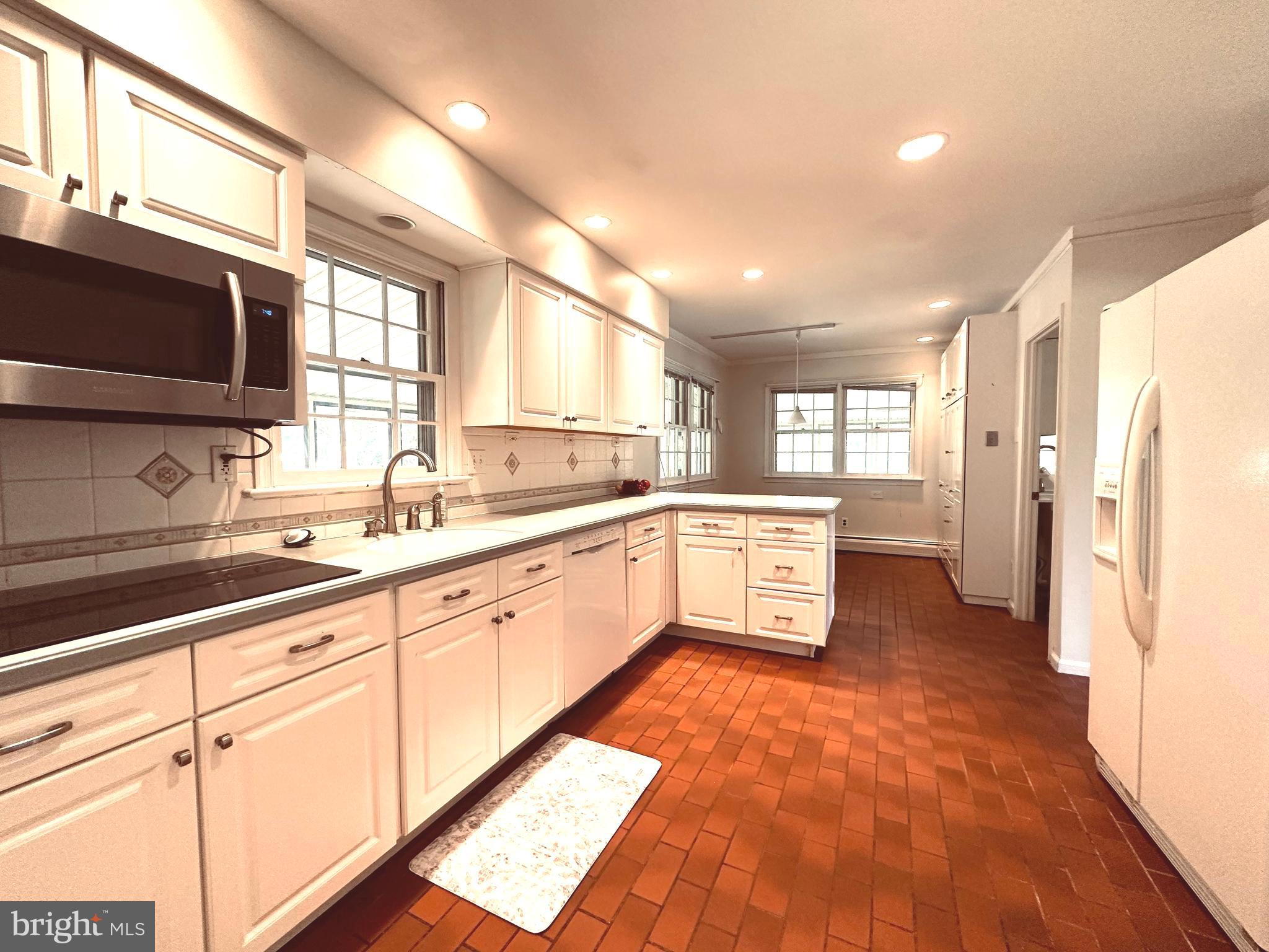 1626 Norristown Road Ambler, PA 19002 - Photo 26 of 57 a large kitchen with cabinets and stainless steel appliances