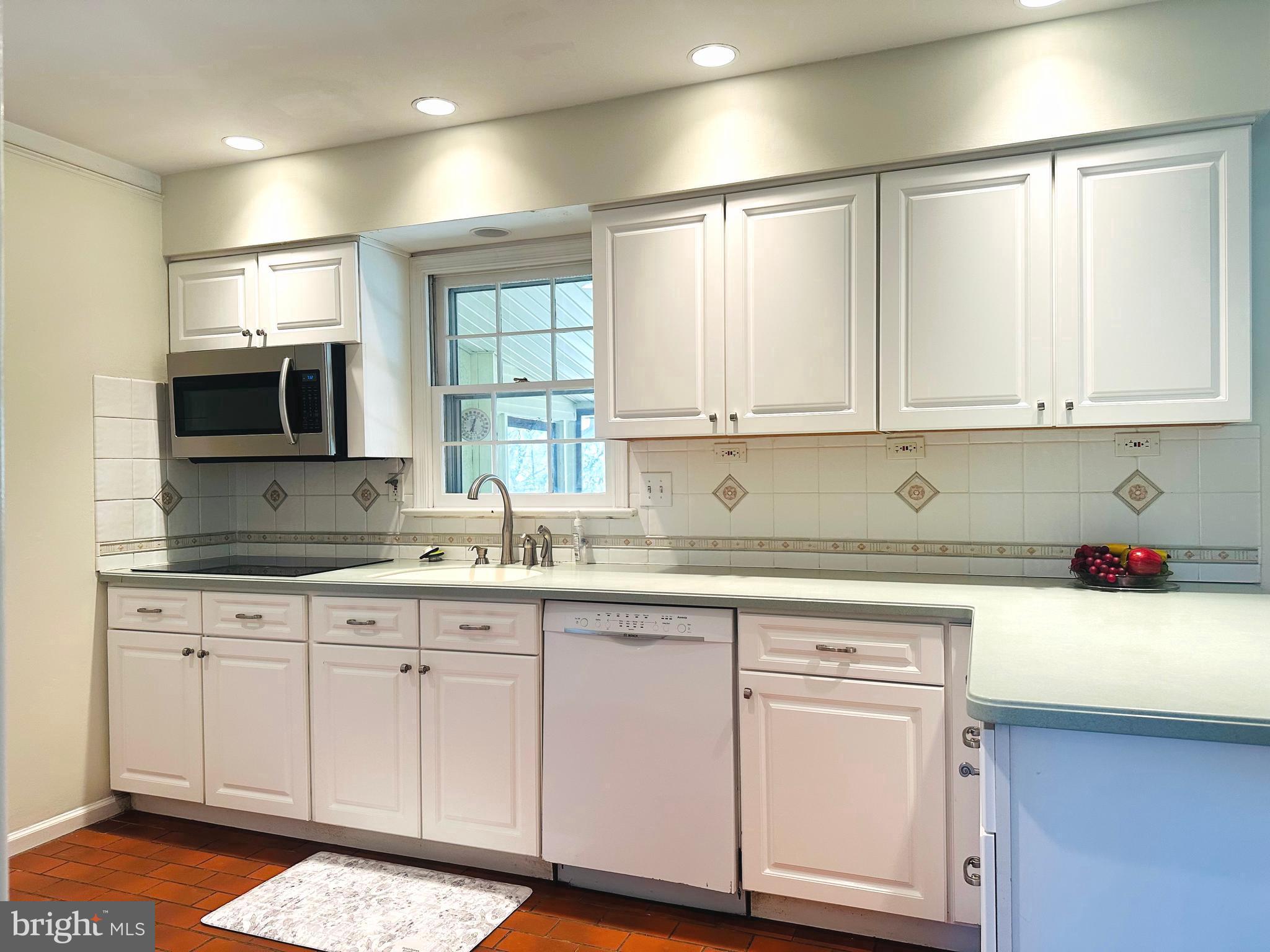 1626 Norristown Road Ambler, PA 19002 - Photo 30 of 57 a kitchen with granite countertop white cabinets and white appliances
