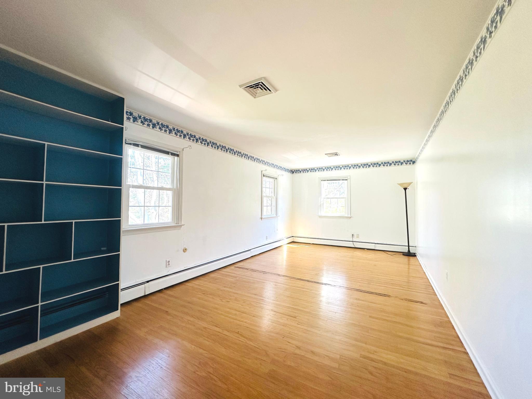 1626 Norristown Road Ambler, PA 19002 - Photo 36 of 57 a view of an empty room with wooden floor and a window