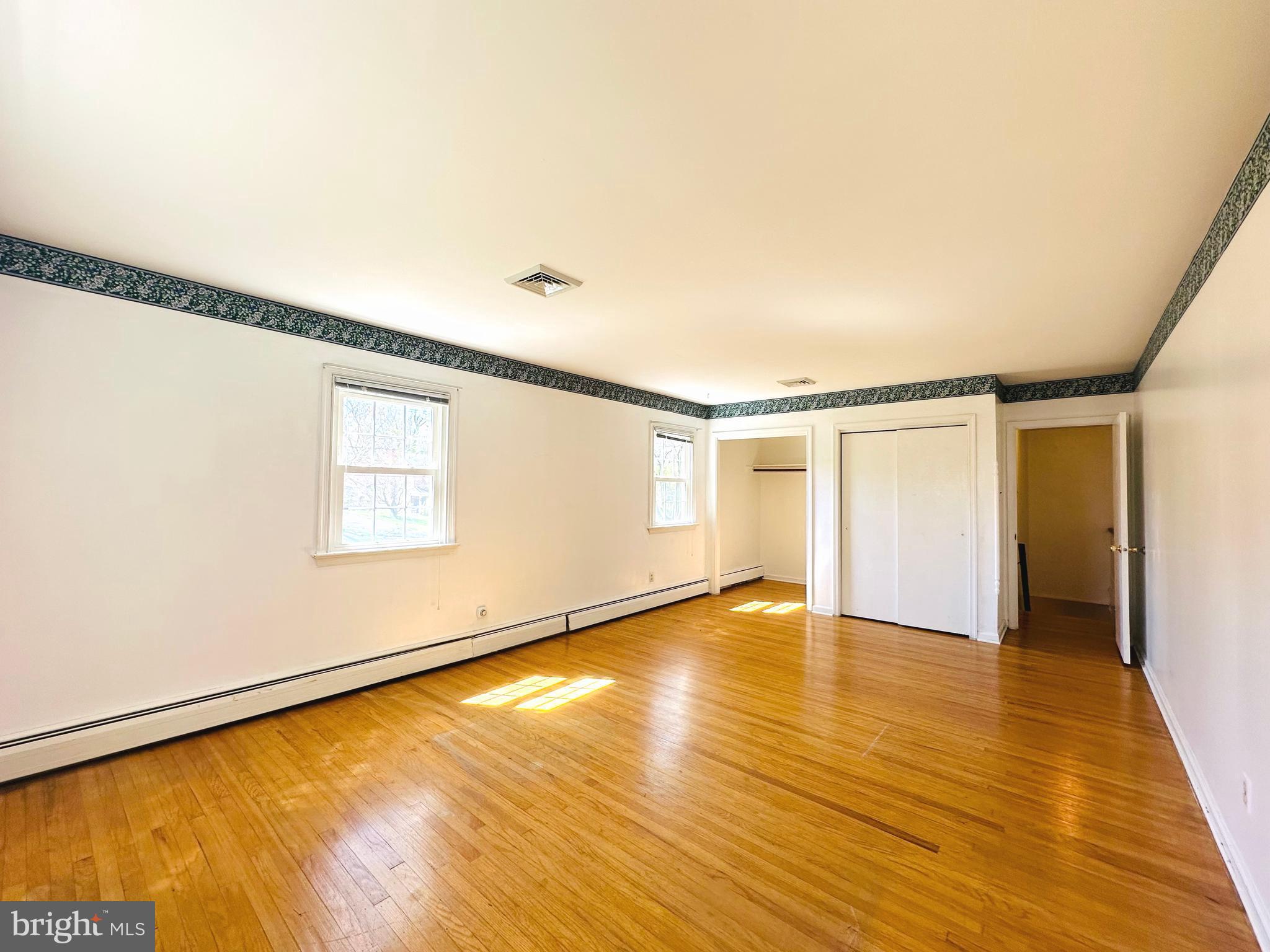 1626 Norristown Road Ambler, PA 19002 - Photo 38 of 57 a view of an empty room with wooden floor and a window