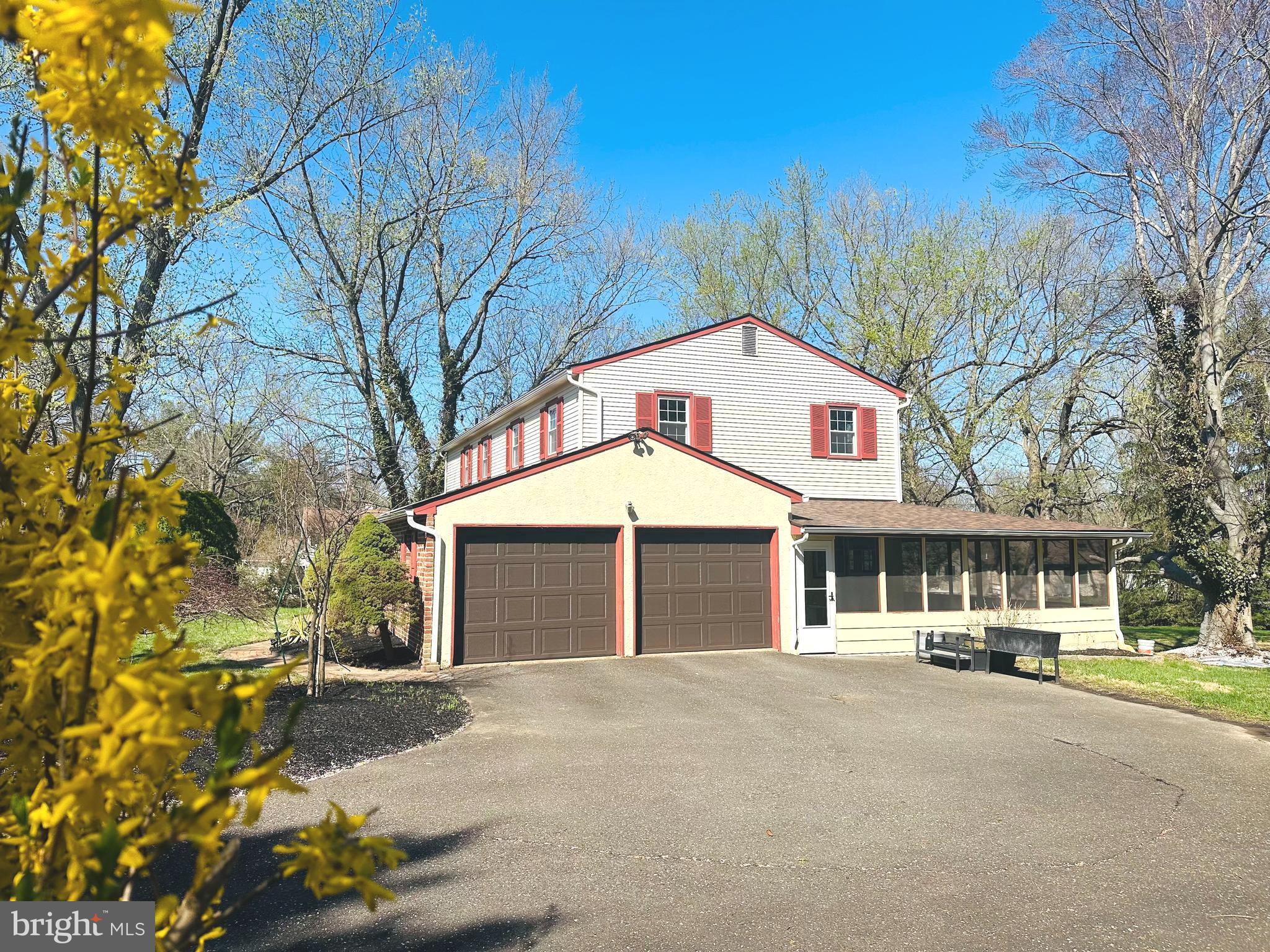 1626 Norristown Road Ambler, PA 19002 - Photo 4 of 57 a front view of a house with a yard and garage