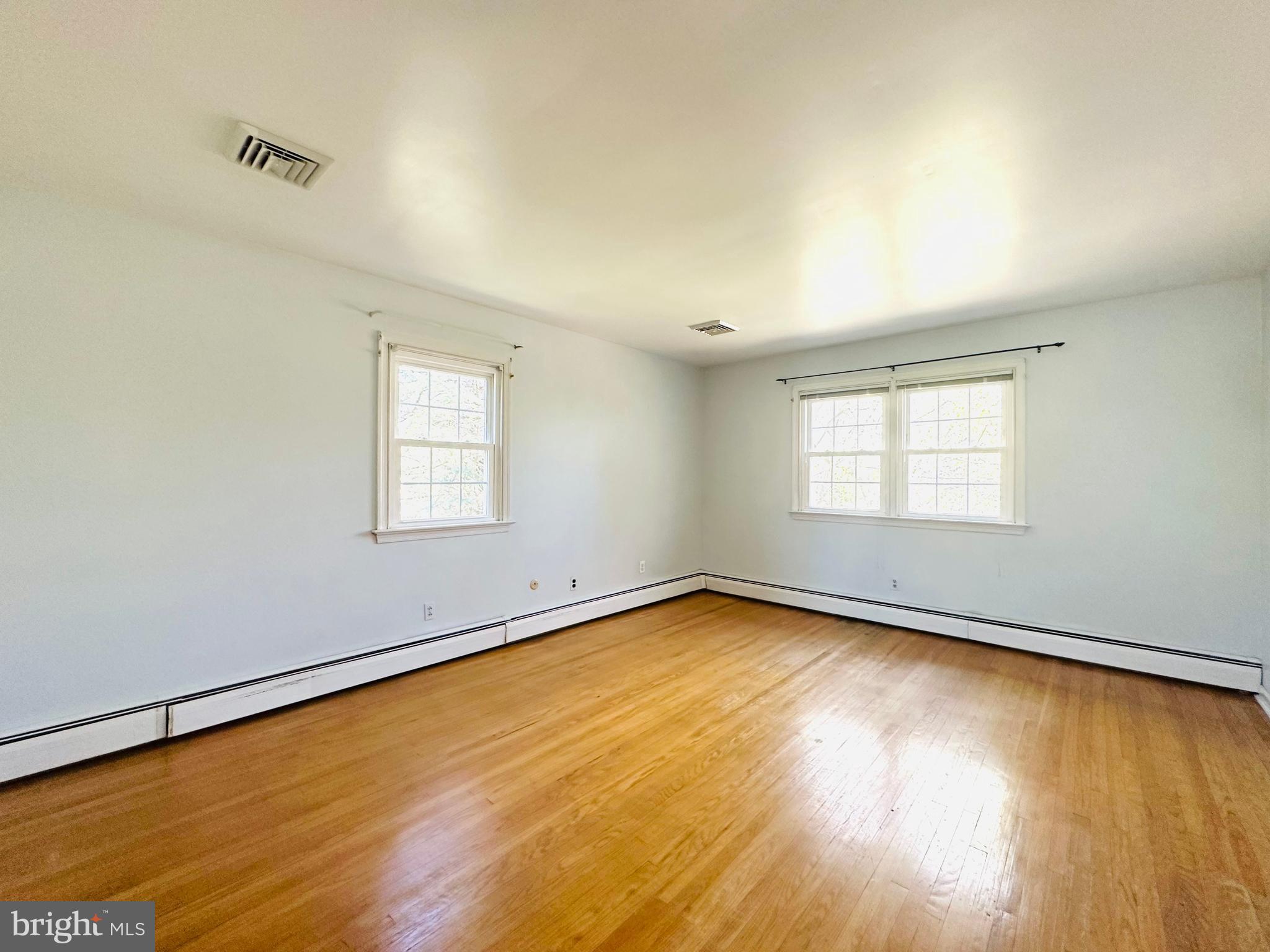 1626 Norristown Road Ambler, PA 19002 - Photo 42 of 57 wooden floor in an empty room with a window