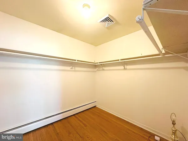 an empty room with large windows