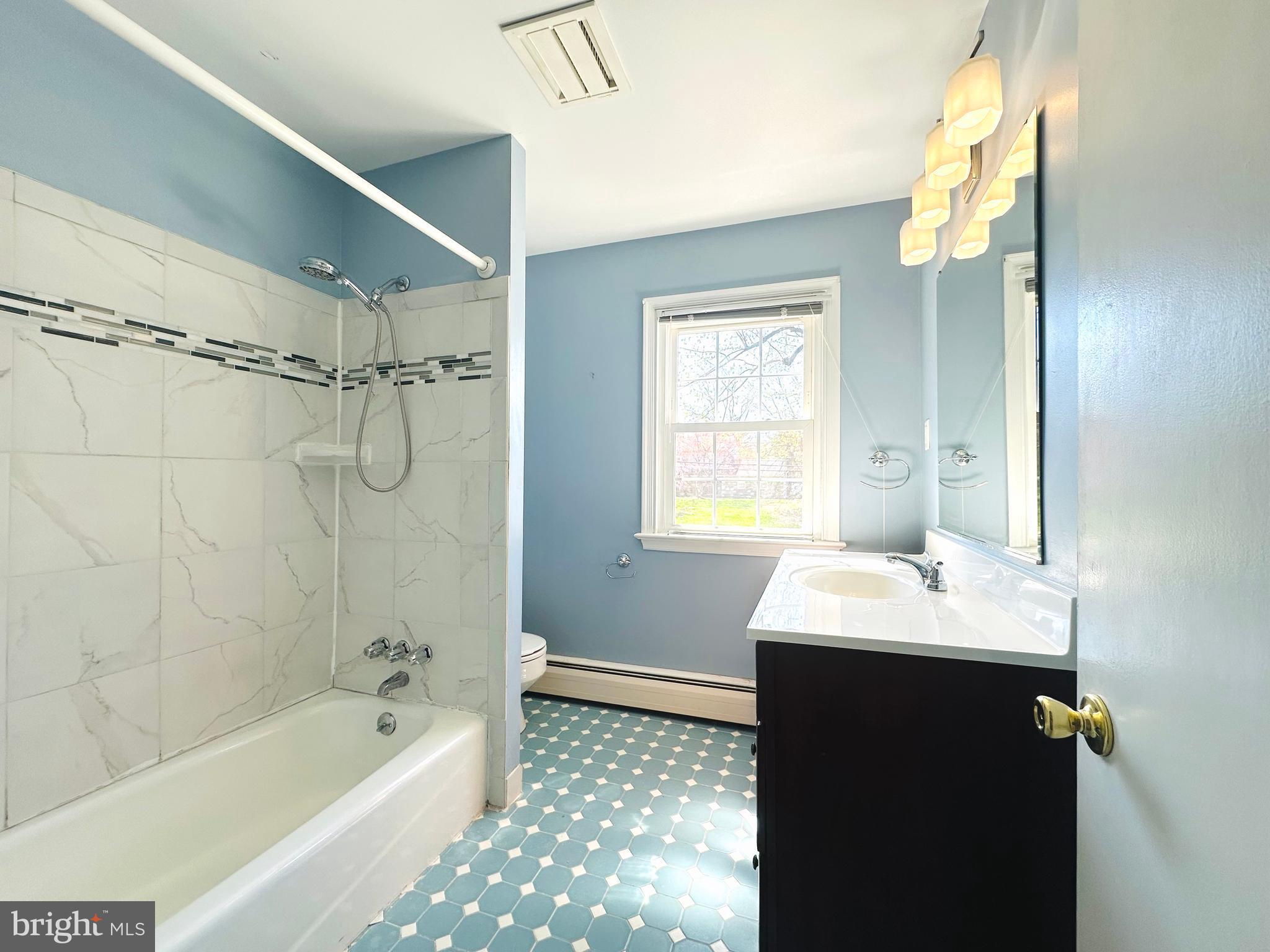 1626 Norristown Road Ambler, PA 19002 - Photo 44 of 57 a bathroom with a tub sink shower and a mirror