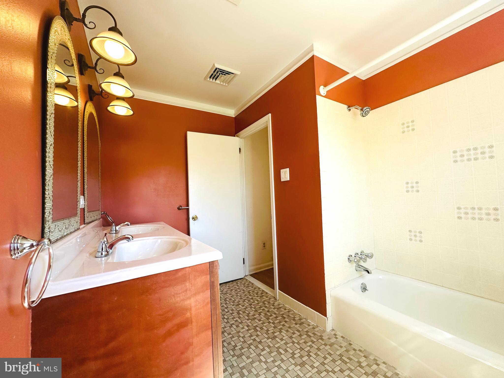1626 Norristown Road Ambler, PA 19002 - Photo 46 of 57 a bathroom with a tub a sink and a mirror