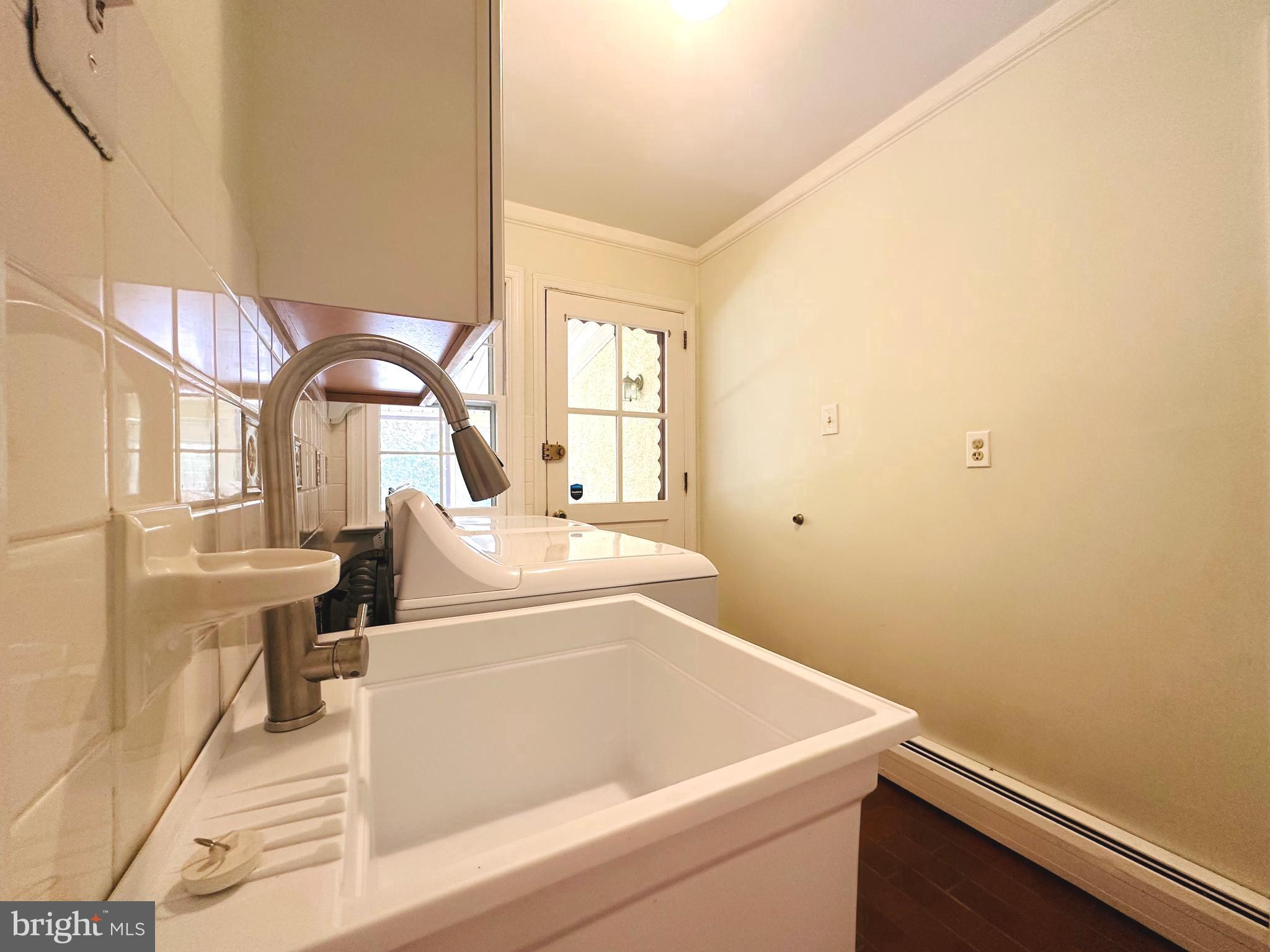 1626 Norristown Road Ambler, PA 19002 - Photo 52 of 57 a white bath tub sitting in a bathroom next to a window