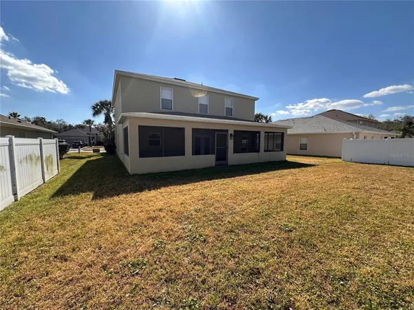 a view of a house with a big yard