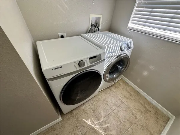 a utility room with dryer and washer