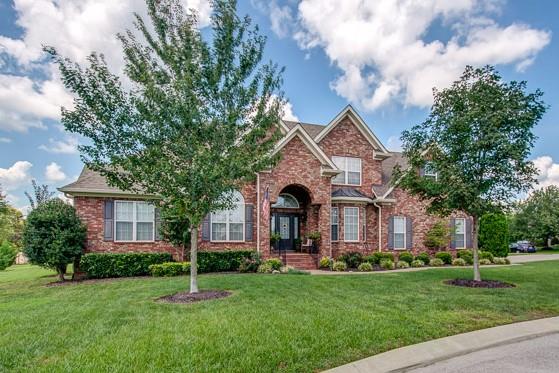 1227 White Rock Road Spring Hill, TN 37174 - Photo 1 of 29 a front view of a house with a garden and trees