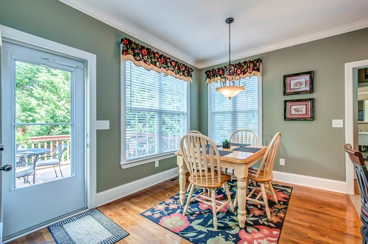 1227 White Rock Road Spring Hill, TN 37174 - Photo 11 of 29 a dining room with furniture a chandelier and wooden floor