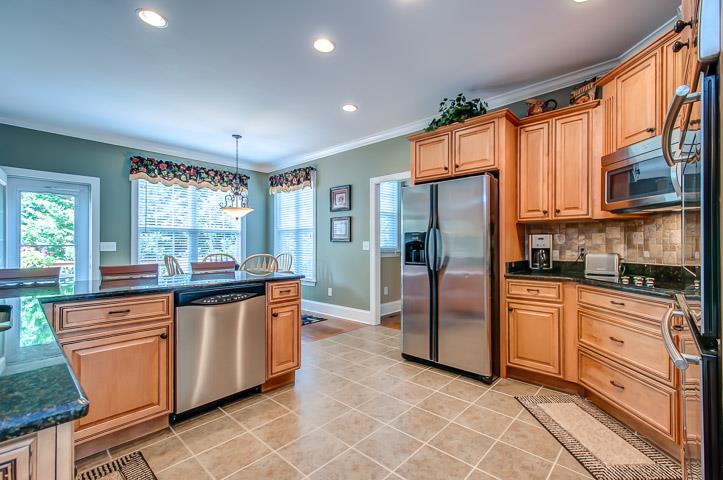 1227 White Rock Road Spring Hill, TN 37174 - Photo 12 of 29 a kitchen with stainless steel appliances granite countertop a refrigerator a stove and a sink