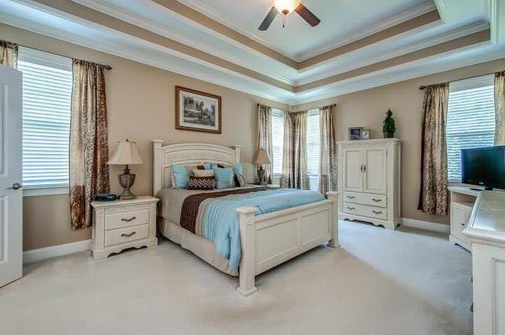 1227 White Rock Road Spring Hill, TN 37174 - Photo 16 of 29 a bedroom with a bed and a flat screen tv