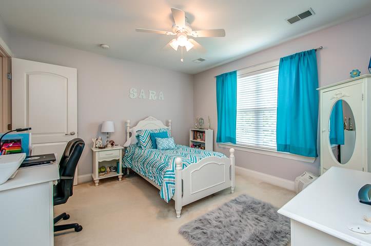 1227 White Rock Road Spring Hill, TN 37174 - Photo 21 of 29 a bedroom with a bed and a chandelier