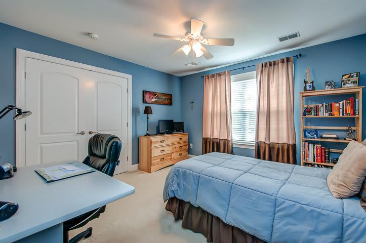 1227 White Rock Road Spring Hill, TN 37174 - Photo 23 of 29 a bedroom with a bed work place and a bookshelf