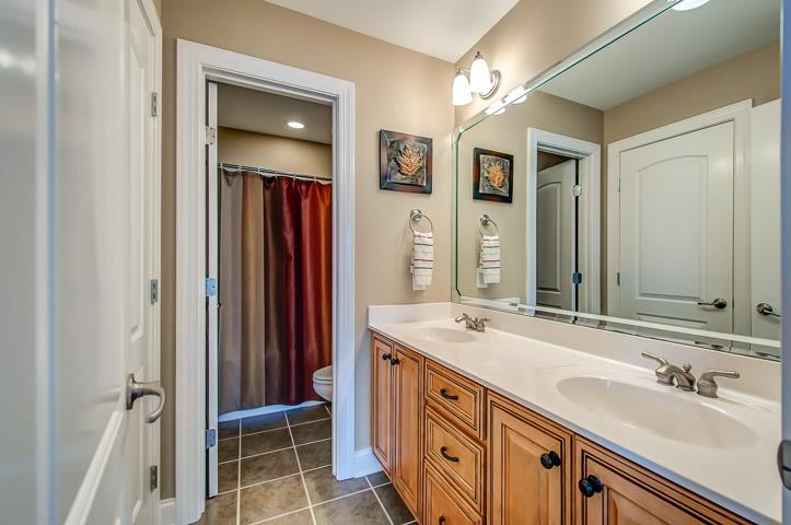 1227 White Rock Road Spring Hill, TN 37174 - Photo 25 of 29 a bathroom with a sink double vanity and a mirror