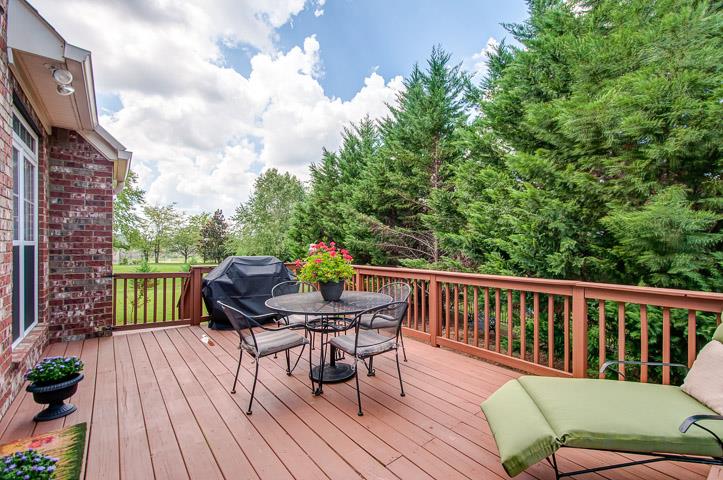 1227 White Rock Road Spring Hill, TN 37174 - Photo 27 of 29 a view of a chair and table on the wooden deck