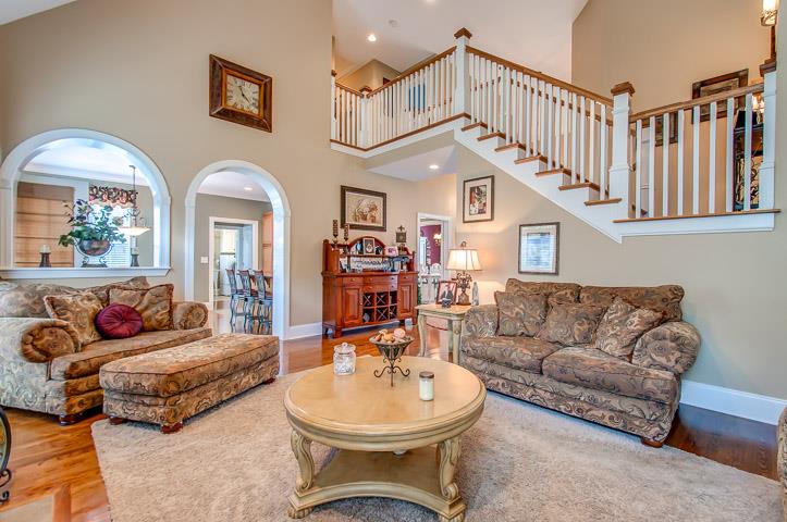 1227 White Rock Road Spring Hill, TN 37174 - Photo 7 of 29 a living room with furniture a couch and a chandelier