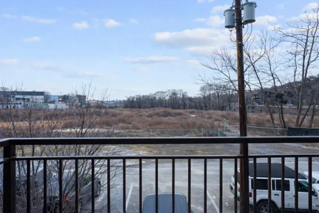 a view of a street from a balcony