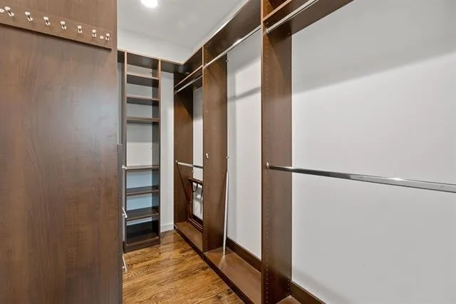 a view of closet area with empty racks