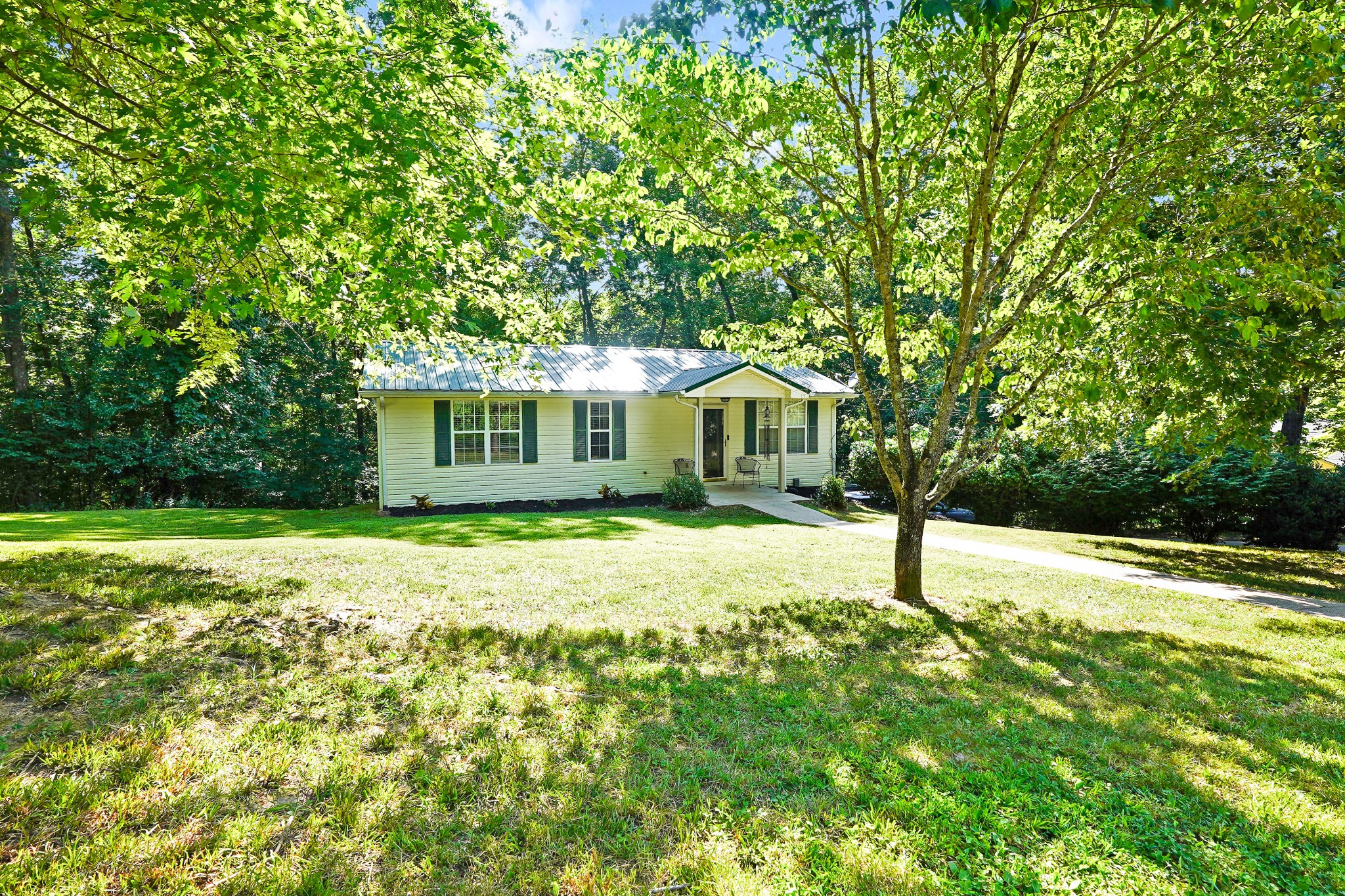 a house with trees in the background