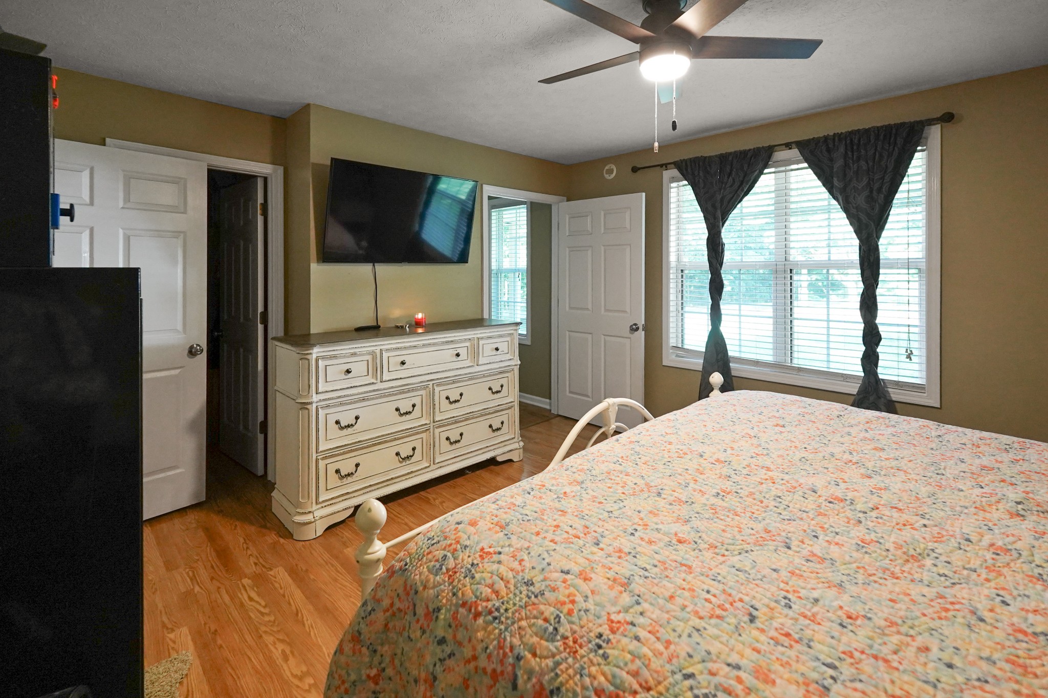 129 Beech Street Dover, TN 37058 - Photo 12 of 27 a bed room with a bed and a television
