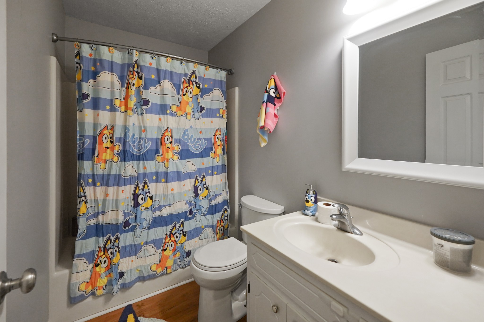 129 Beech Street Dover, TN 37058 - Photo 17 of 27 a bathroom with a sink toilet and shower curtain