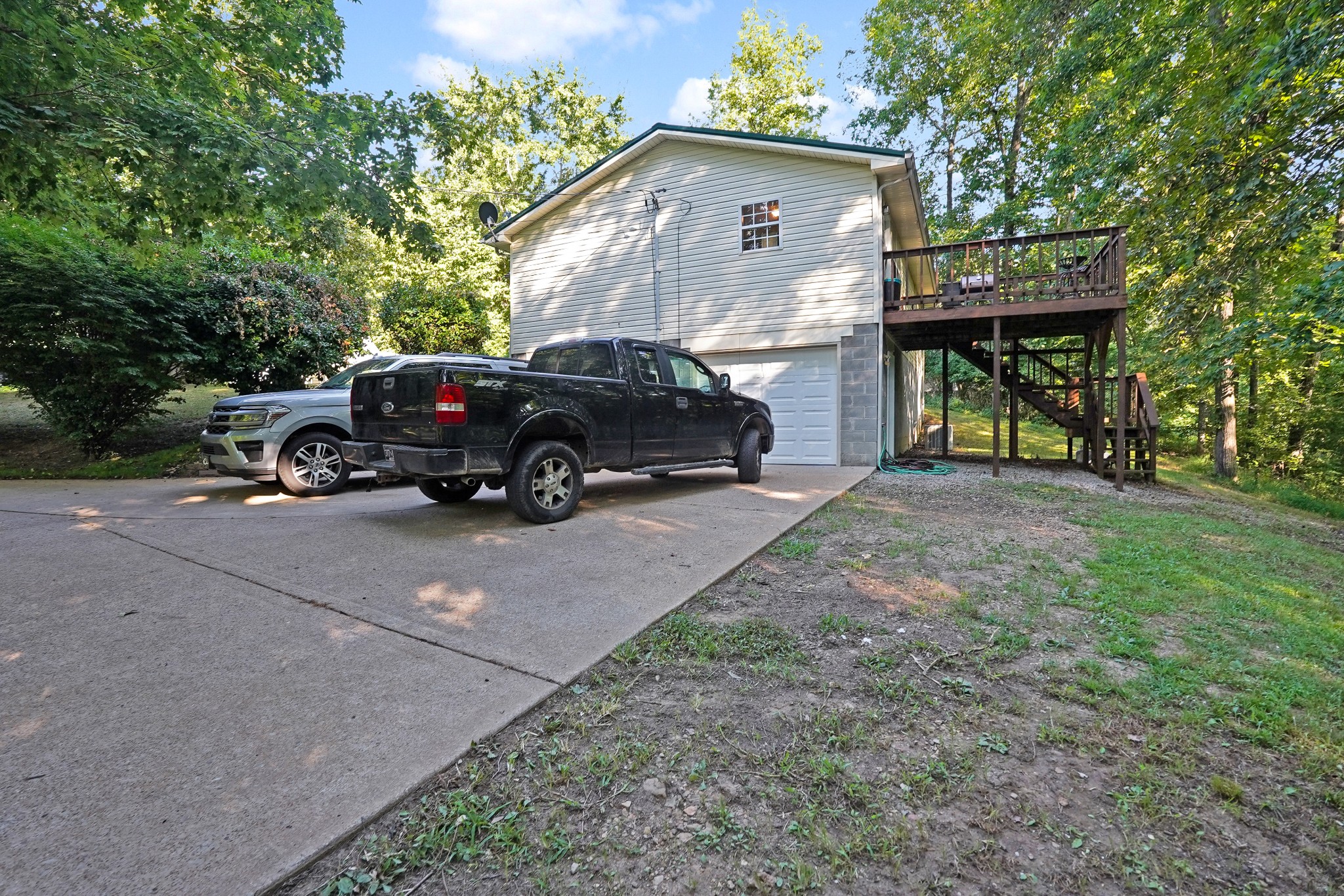129 Beech Street Dover, TN 37058 - Photo 20 of 27 a car parked in front of a house