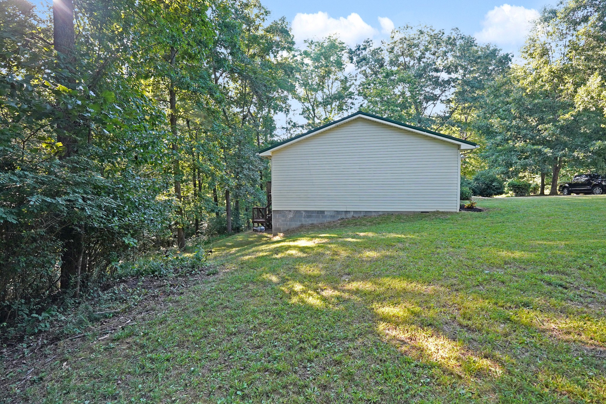 129 Beech Street Dover, TN 37058 - Photo 22 of 27 a backyard of a house with lots of green space