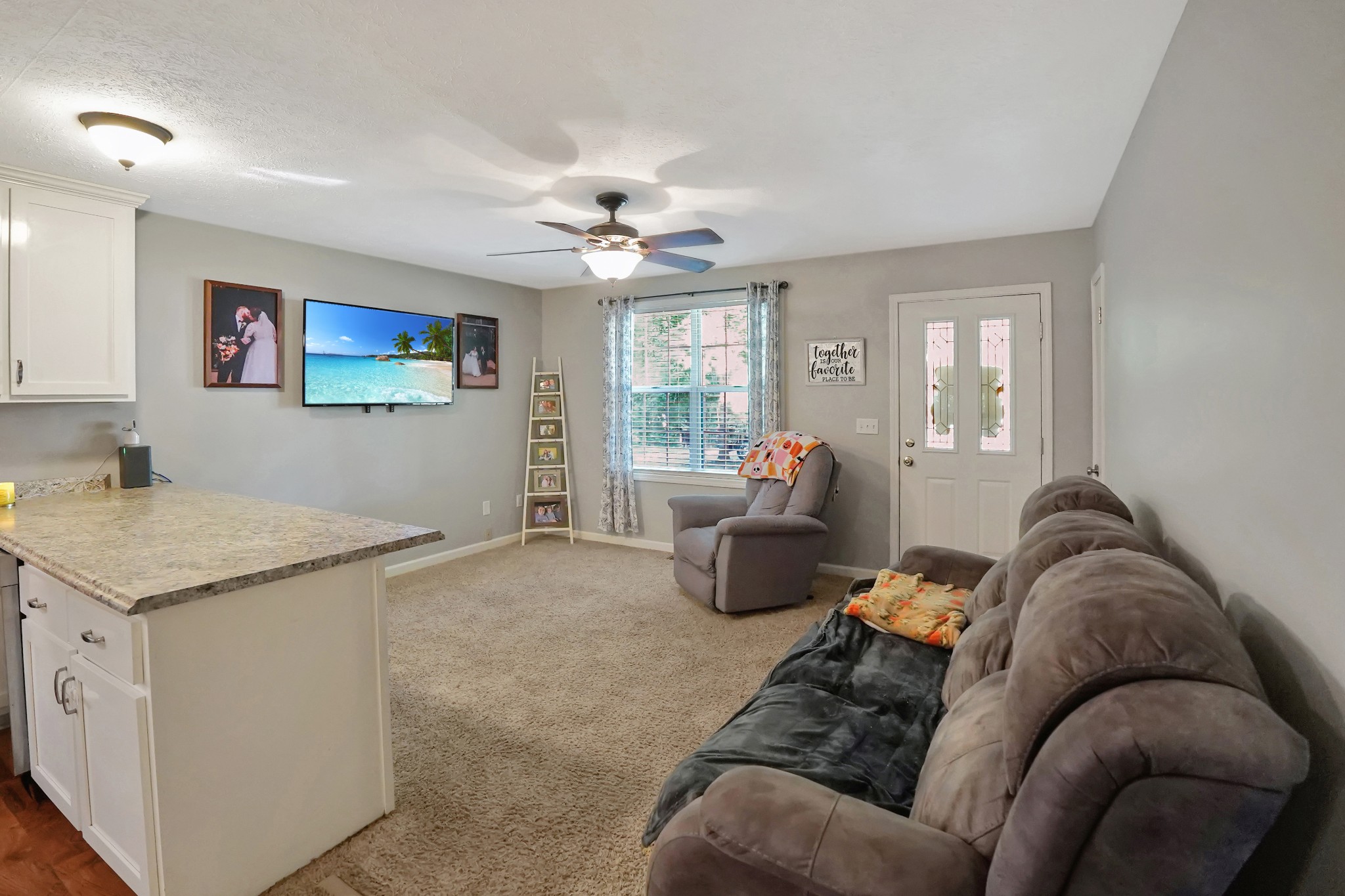 129 Beech Street Dover, TN 37058 - Photo 3 of 27 a living room with furniture and a flat screen tv