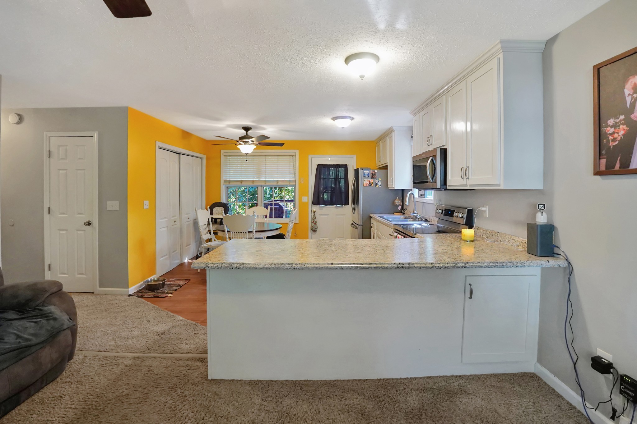 129 Beech Street Dover, TN 37058 - Photo 5 of 27 a view of living room with granite countertop furniture and a large window