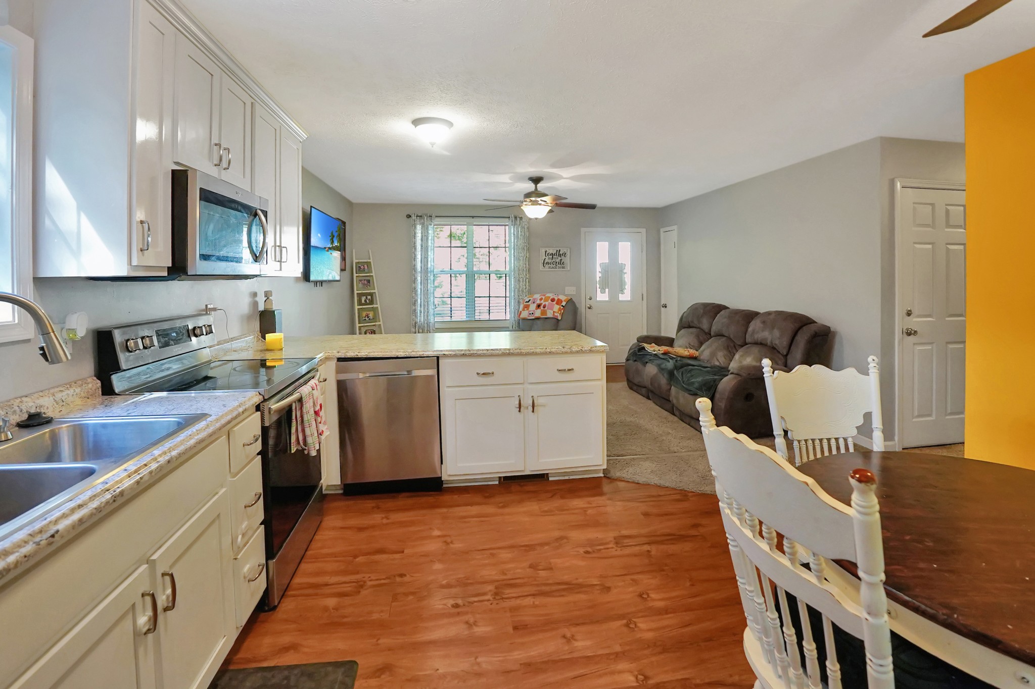 129 Beech Street Dover, TN 37058 - Photo 9 of 27 a kitchen with a sink stove and cabinets