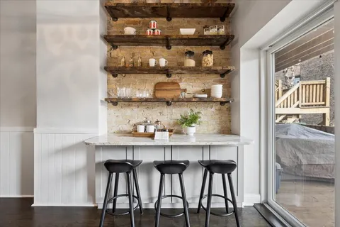 a kitchen with a table and chairs in it