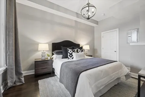 a bedroom with bed and a window