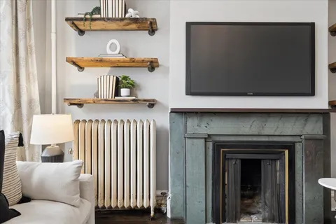 a living room with furniture and a fireplace