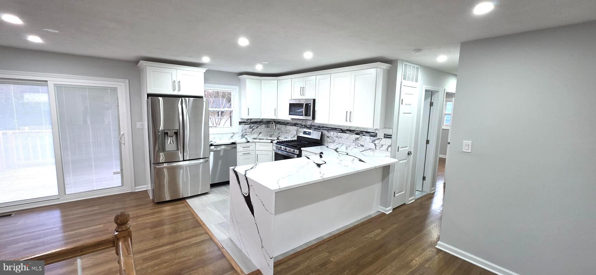 4813 Lawrence Street Alexandria, VA 22309 - Photo 17 of 66 a kitchen with refrigerator and cabinets
