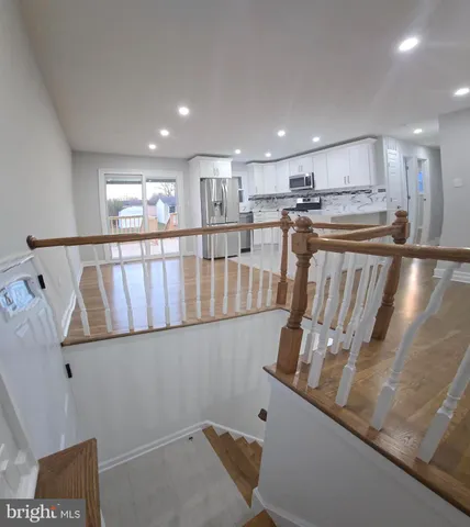 a view of a room with wooden floor