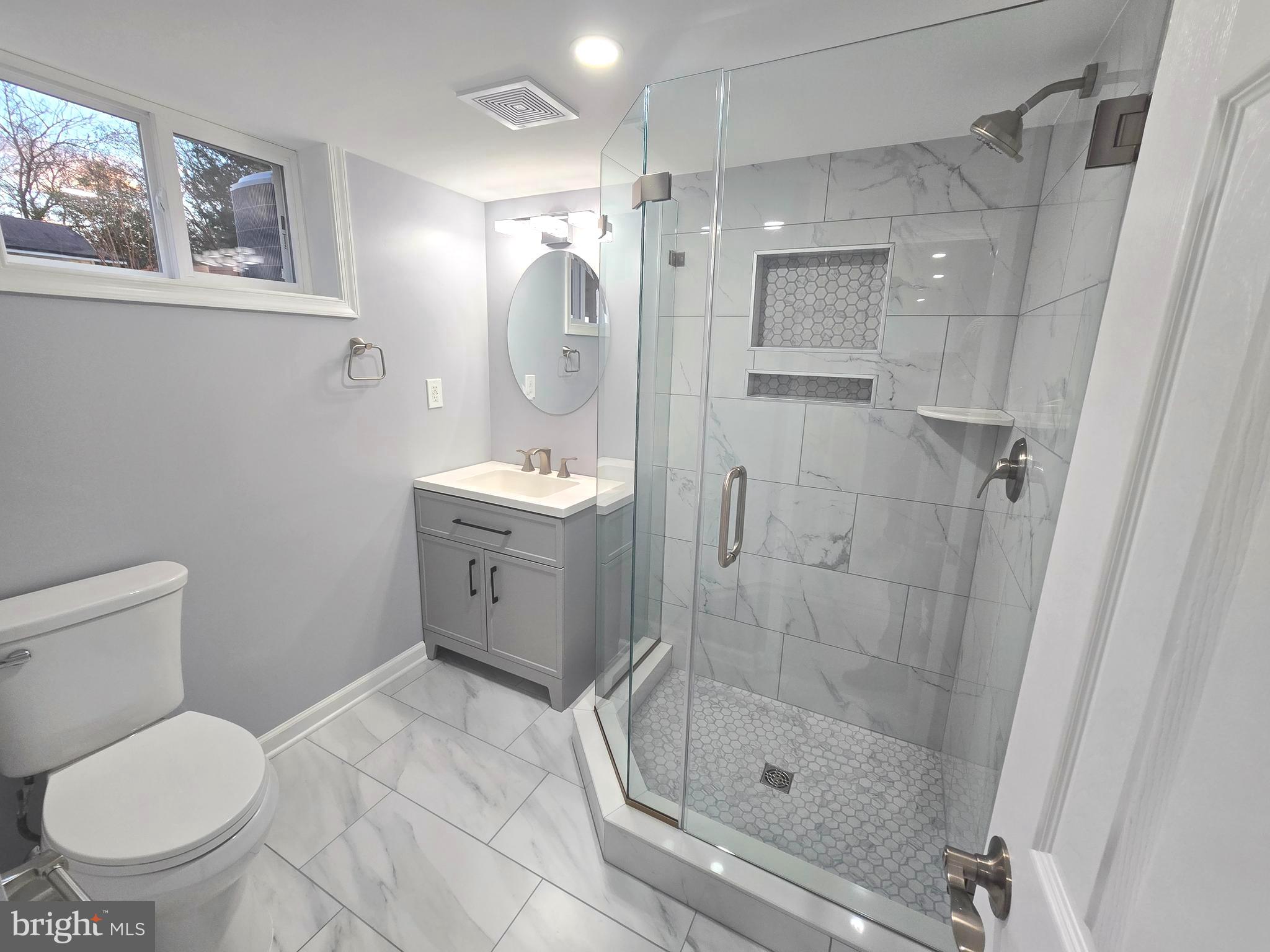 4813 Lawrence Street Alexandria, VA 22309 - Photo 32 of 66 a bathroom with a toilet sink and shower