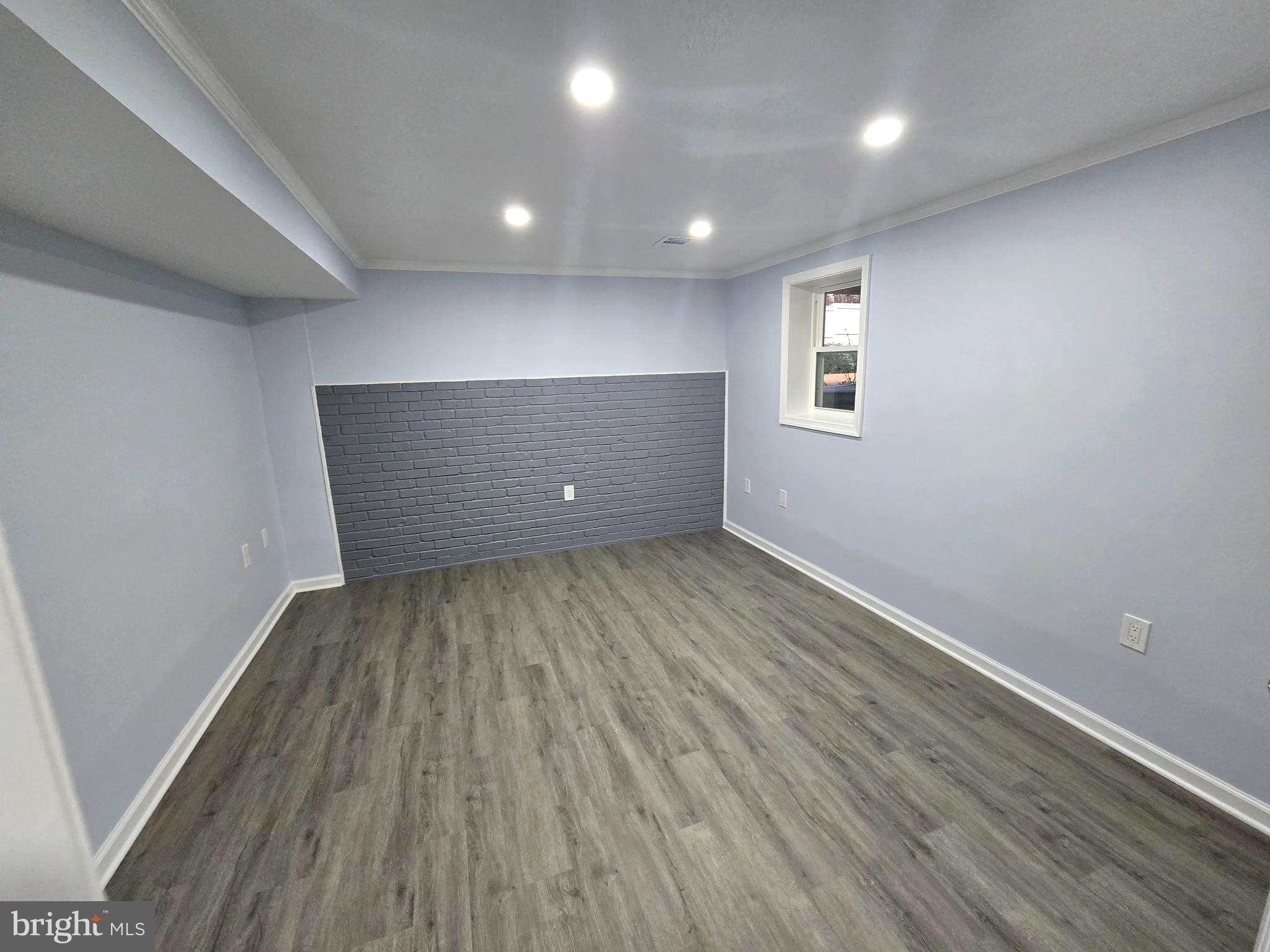 4813 Lawrence Street Alexandria, VA 22309 - Photo 33 of 66 an empty room with wooden floor and windows