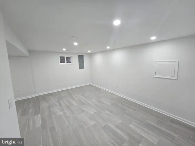a kitchen with granite countertop a sink and cabinets