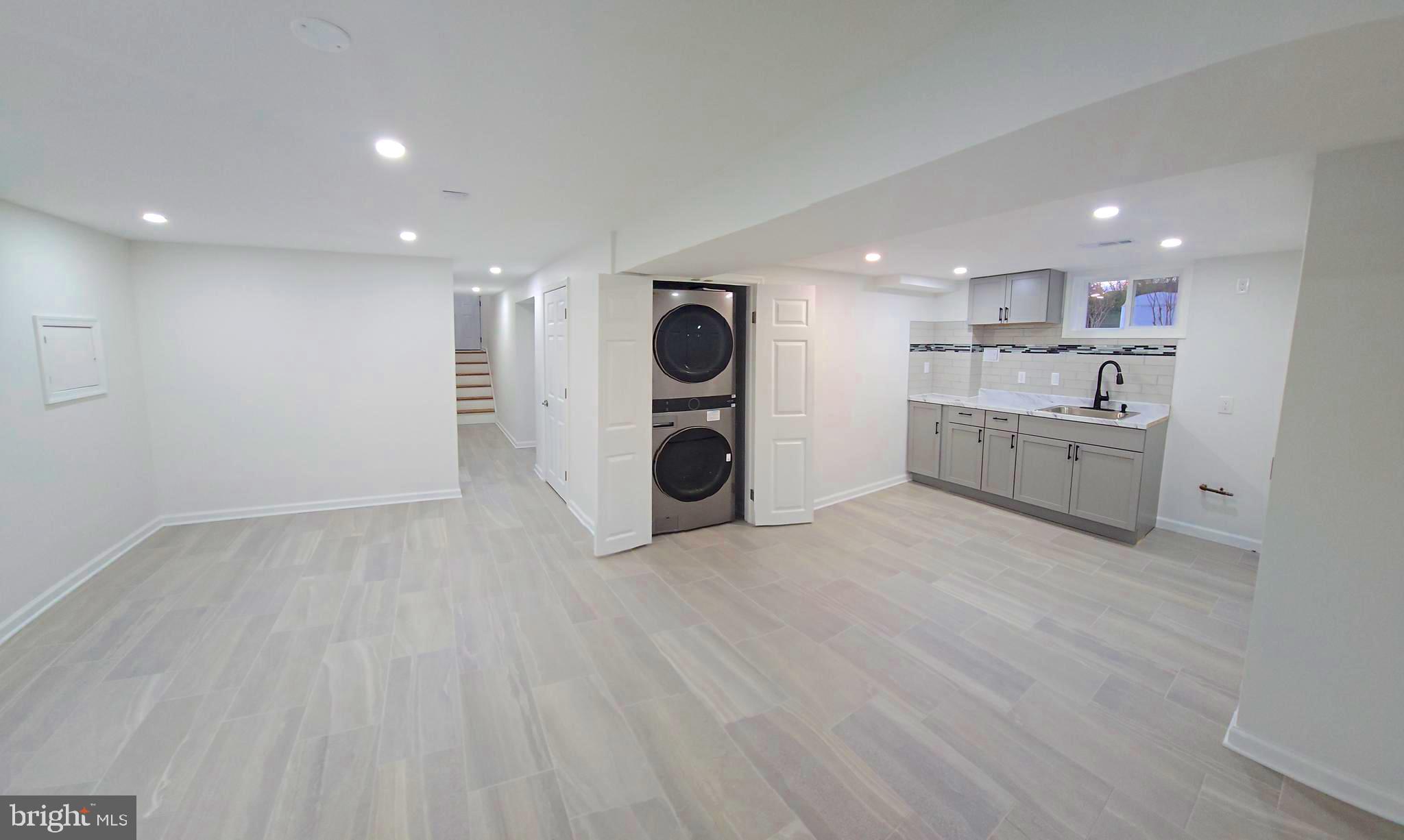 4813 Lawrence Street Alexandria, VA 22309 - Photo 40 of 66 a view of a kitchen with a sink and a refrigerator