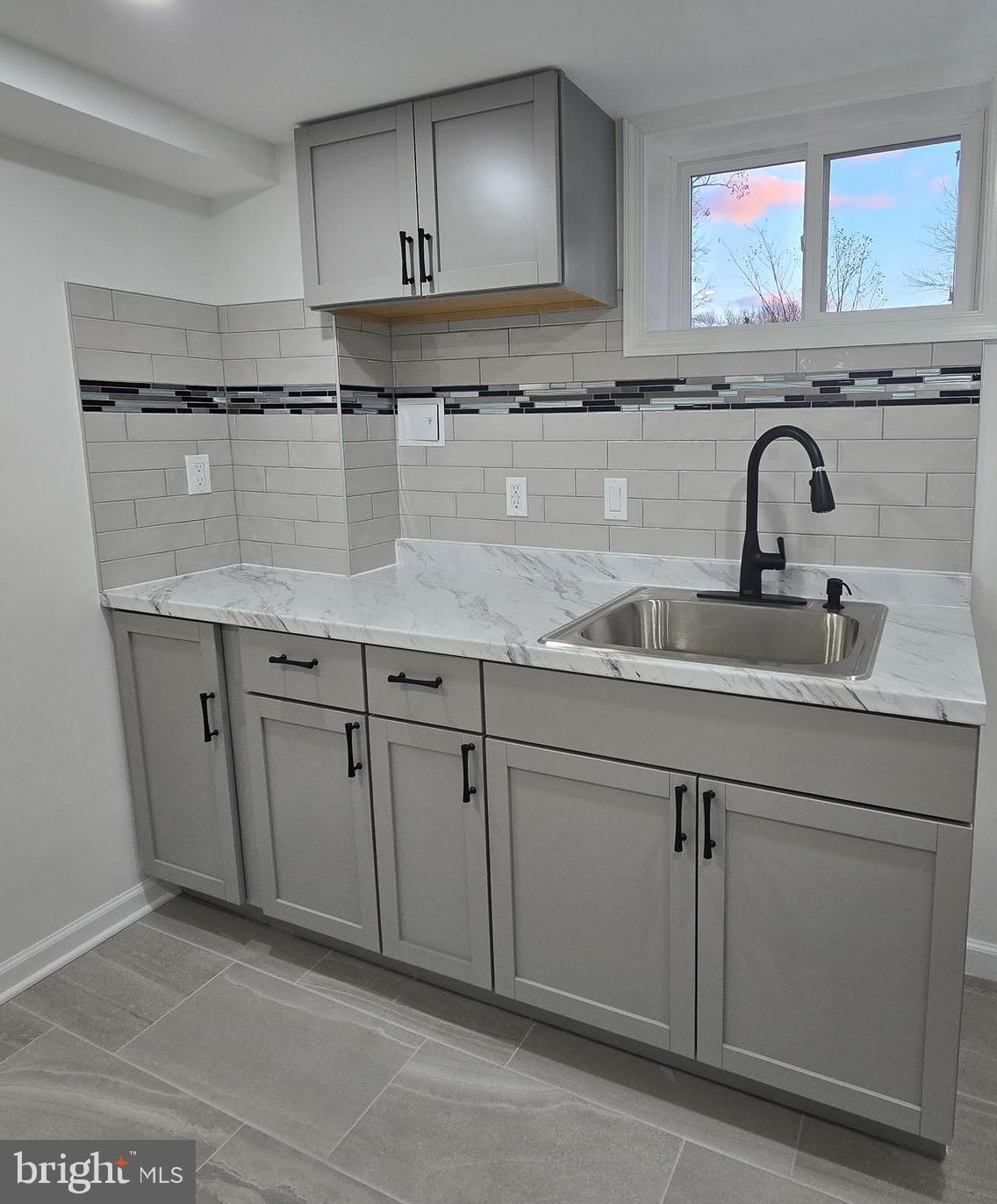 4813 Lawrence Street Alexandria, VA 22309 - Photo 43 of 66 a kitchen with granite countertop a sink and cabinets