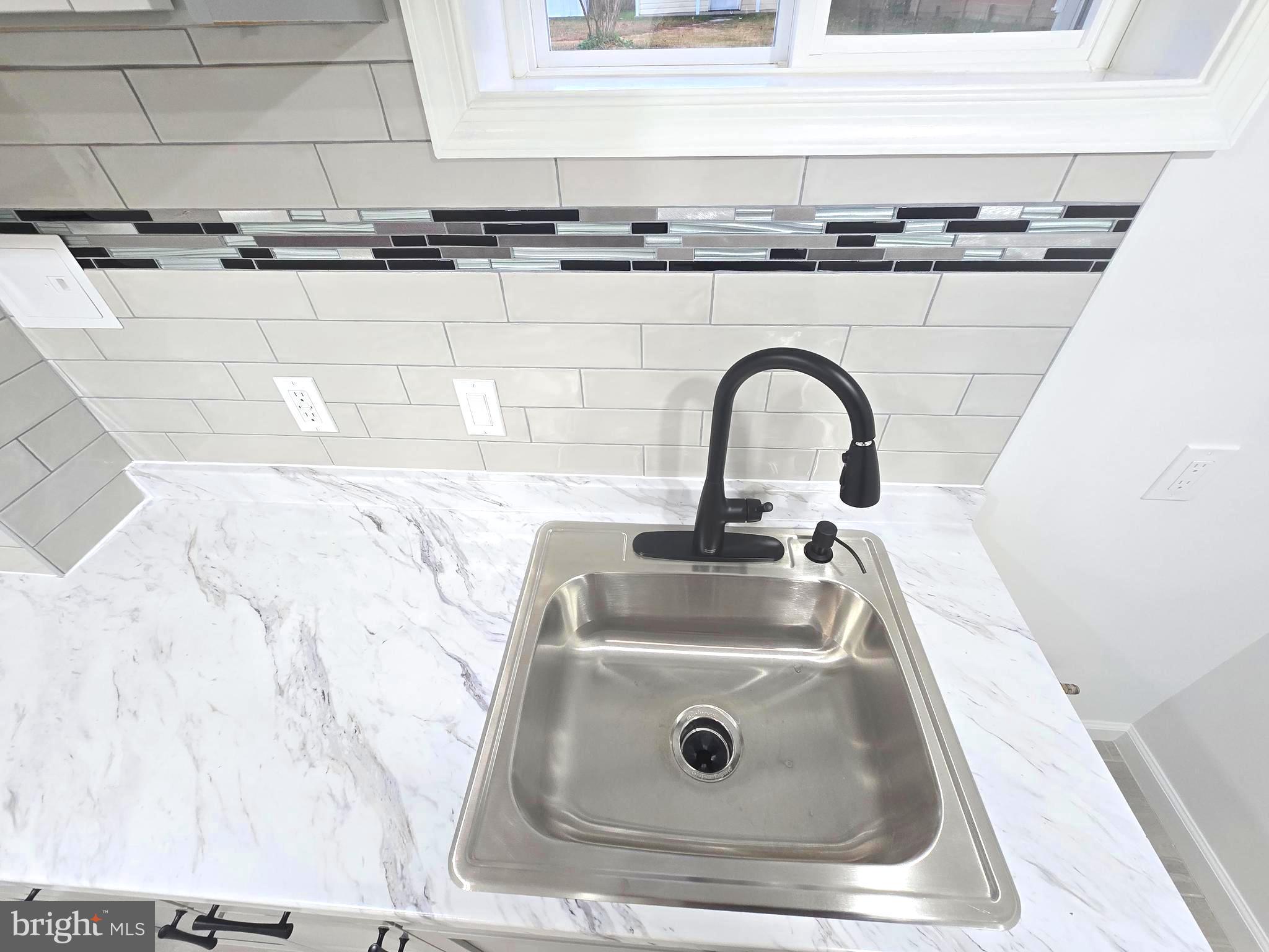 4813 Lawrence Street Alexandria, VA 22309 - Photo 47 of 66 a close view of sink and tap