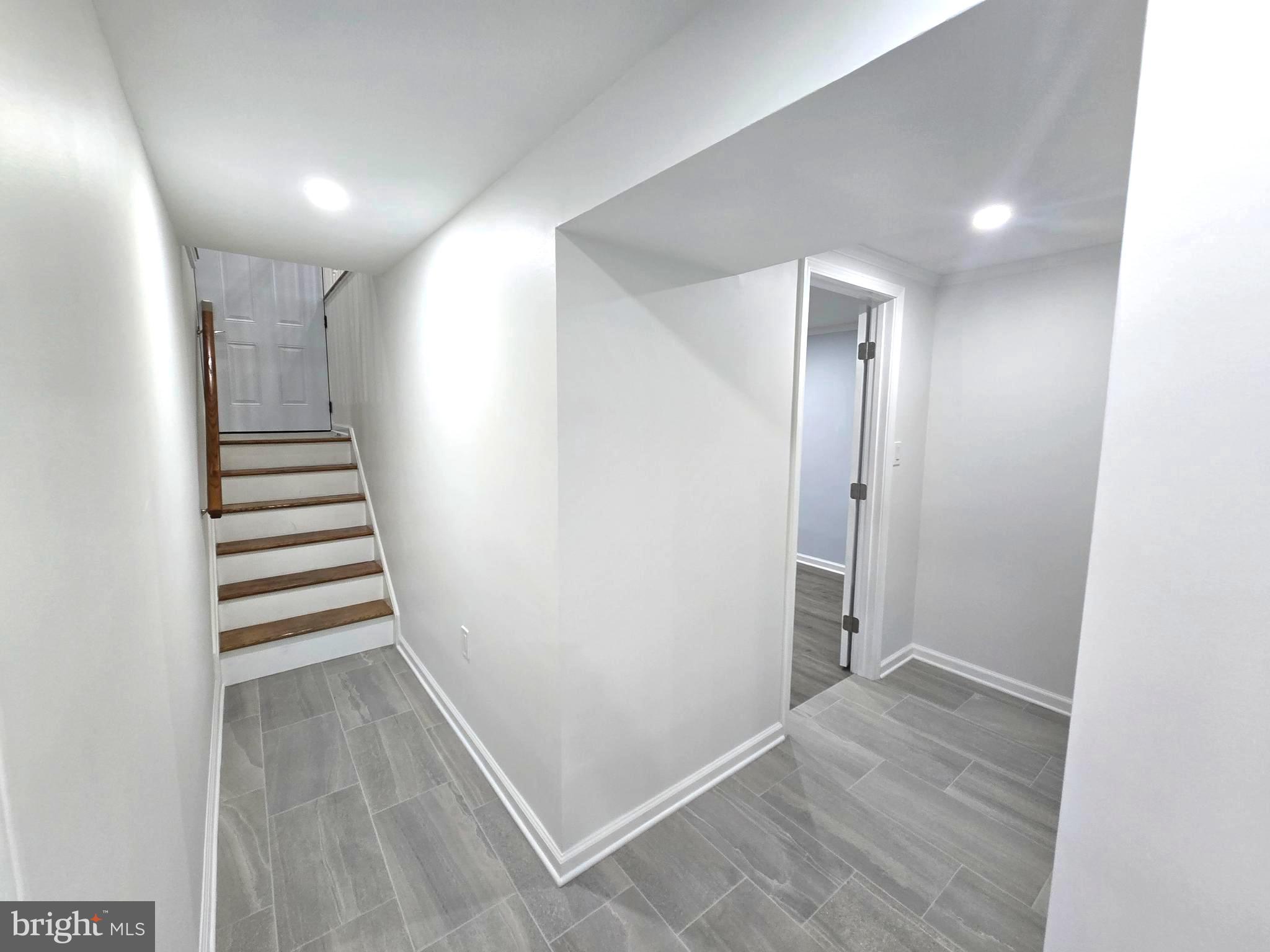 4813 Lawrence Street Alexandria, VA 22309 - Photo 49 of 66 a view of a hallway with entryway and stairs