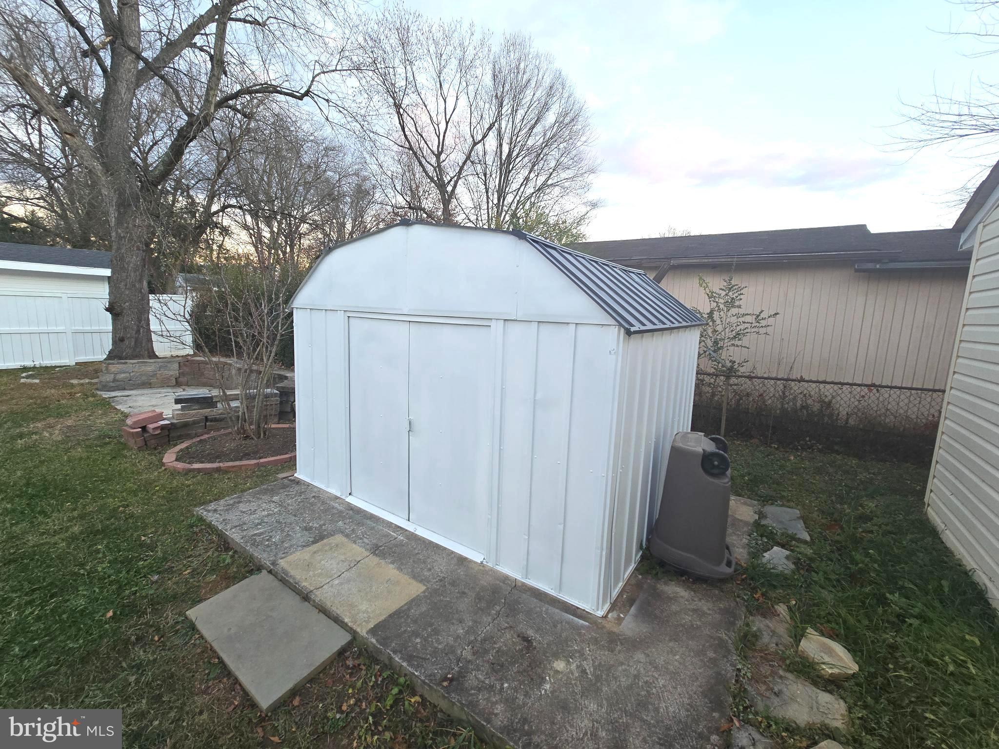 4813 Lawrence Street Alexandria, VA 22309 - Photo 54 of 66 a view of a house with a small yard and large tree